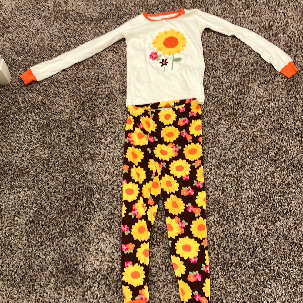 This is a pajama set that has flowers on it